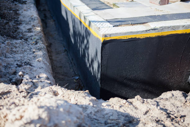 Professional Emergency Waterproofing technician working in Westmont, IL